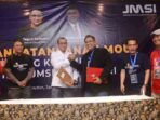 Ketua Umum JMSI, Teguh Santosa dan Ketua KPU RI, Hasyim Asy’ari, salam komando